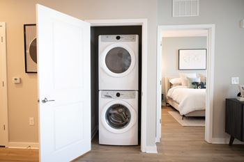 A white washer and dryer in a laundry room.
